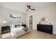 Bright bedroom features a ceiling fan and stylish furniture, including a cozy bed with throw pillows at 1020 W Princeton St, Orlando, FL 32804