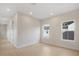 Bright bedroom featuring light wood floors, white trim, neutral walls, and plenty of natural light from two windows at 1020 W Princeton St, Orlando, FL 32804