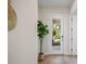 Bright entryway with a stylish plant, and door leading to the home's exterior at 1020 W Princeton St, Orlando, FL 32804