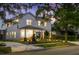 Two-story home with a modern design, well-manicured landscaping, and a covered porch on the side of the home at 1020 W Princeton St, Orlando, FL 32804