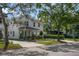 Charming two-story home with landscaped yard, portico, and driveway at 1020 W Princeton St, Orlando, FL 32804