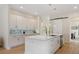 Modern kitchen with quartz countertops, white cabinets, and stainless steel appliances at 1020 W Princeton St, Orlando, FL 32804