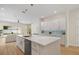 This bright kitchen features a large island, modern appliances and an open layout to the living area at 1020 W Princeton St, Orlando, FL 32804