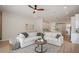 Spacious living room featuring a plush sectional sofa and an open layout that flows into the kitchen and dining areas at 1020 W Princeton St, Orlando, FL 32804