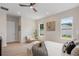 Serene main bedroom with neutral tones, ample natural light, and contemporary furnishings, and wood-look floors at 1020 W Princeton St, Orlando, FL 32804