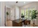 A bright home office with a large window and garden view at 1020 W Princeton St, Orlando, FL 32804