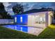 Backyard pool featuring modern design, and an open covered patio with sliding glass doors leading to the home's interior at 1020 W Princeton St, Orlando, FL 32804