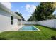 Backyard pool area with manicured lawn, offering a tranquil and private outdoor living space at 1020 W Princeton St, Orlando, FL 32804