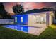 Backyard with a modern pool and a covered patio, perfect for relaxation and entertainment at 1020 W Princeton St, Orlando, FL 32804