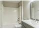 Bathroom featuring a tub/shower combo, modern vanity, and updated fixtures at 1928 Michigan Ct, Kissimmee, FL 34759