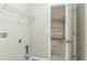 Functional laundry room with open access to the garage for convenience at 1928 Michigan Ct, Kissimmee, FL 34759