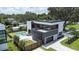 Aerial view showcasing the modern home with a backyard pool, patio, and lush landscaping at 2522 Lafayette Ave, Winter Park, FL 32789