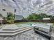 Backyard featuring a modern pool, jacuzzi, firepit, and outdoor entertaining area at 2522 Lafayette Ave, Winter Park, FL 32789