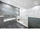 Bright bathroom with a glass shower, tub, and contemporary vanity with dual sinks, offering a spa-like experience at 2522 Lafayette Ave, Winter Park, FL 32789