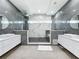 Elegant bathroom with dual vanities, walk-in shower with rainfall head, and sleek modern design for a spa-like experience at 2522 Lafayette Ave, Winter Park, FL 32789