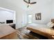 Comfortable bedroom with wood floors, a ceiling fan, and a dedicated workspace, perfect for relaxation and productivity at 2522 Lafayette Ave, Winter Park, FL 32789