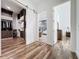 Hallway with wood floors that leads to a modern closet and a bathroom with a modern design at 2522 Lafayette Ave, Winter Park, FL 32789