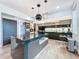 The kitchen features sleek cabinetry, stainless steel appliances, and a stylish island at 2522 Lafayette Ave, Winter Park, FL 32789
