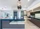 The modern kitchen is complete with a large island and stainless steel appliances at 2522 Lafayette Ave, Winter Park, FL 32789