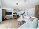Spacious living room with modern furnishings, an open layout, and large windows for natural light at 2522 Lafayette Ave, Winter Park, FL 32789