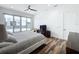 Stylish bedroom with modern ceiling fan, wood floors, and balcony access offering a comfortable and elegant retreat at 2522 Lafayette Ave, Winter Park, FL 32789