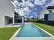 Backyard oasis featuring a modern pool, jacuzzi, and well-manicured lawn at 2522 Lafayette Ave, Winter Park, FL 32789