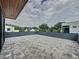 Expansive rooftop deck with sleek gray pavers and modern railing, offering stunning views of the surrounding neighborhood at 2522 Lafayette Ave, Winter Park, FL 32789