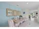 Dining room with light blue accent wall and a wooden table at 3503 Fort Mellon Ln, Sanford, FL 32773