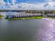 Aerial view of waterfront property, showcasing the building and lake at 4113 Fairview Vista Pt # 212, Orlando, FL 32804