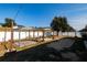 A backyard with sand, a swing set, and a fence around the perimeter at 176 Blackstone Creek Rd, Groveland, FL 34736