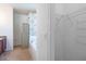 Bathroom featuring a soaking tub with tiled shower, wood cabinets, and a walk-in closet at 176 Blackstone Creek Rd, Groveland, FL 34736