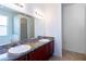 Bathroom with double vanity sinks, granite countertops, decorative lighting, and a soaking tub with tiled shower at 176 Blackstone Creek Rd, Groveland, FL 34736