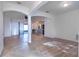 Bright living room featuring a combination of tile and wood floors and lots of natural light from a sliding glass door at 176 Blackstone Creek Rd, Groveland, FL 34736