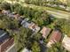 An aerial view shows residences nestled in a lush, green landscape, complete with a glistening pool at 226 W Tarrington Dr, Deland, FL 32724