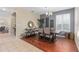 Open dining room boasts hardwood floors, stylish decor, and modern chandelier, perfect for Gathering gatherings at 226 W Tarrington Dr, Deland, FL 32724