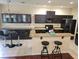 Full kitchen view of spacious design, granite counter tops, dark cabinetry and tile flooring at 226 W Tarrington Dr, Deland, FL 32724