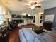 Open-concept living room flows into kitchen; features hardwood floors, modern decor, and ample natural light at 226 W Tarrington Dr, Deland, FL 32724