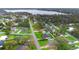 Neighborhood with well-maintained lawns and mature trees at 304 Hibiscus St, Chuluota, FL 32766