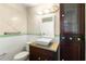 Bathroom boasts modern fixtures and a wooden storage cabinet at 304 Hibiscus St, Chuluota, FL 32766