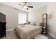 Comfortable bedroom featuring a ceiling fan, closet, and a bright window at 304 Hibiscus St, Chuluota, FL 32766