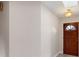 Inviting entryway with a skylight and a rustic wooden front door at 304 Hibiscus St, Chuluota, FL 32766