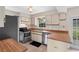 Bright kitchen with wood countertops and stainless steel appliances at 304 Hibiscus St, Chuluota, FL 32766