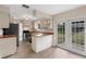 Bright kitchen features wood countertops, stainless steel appliances, and access to the backyard at 304 Hibiscus St, Chuluota, FL 32766