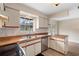 Well-lit kitchen with stainless steel sink, wood countertops, and white cabinets at 304 Hibiscus St, Chuluota, FL 32766