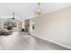 Spacious living room with hardwood floors, fireplace, and large windows at 304 Hibiscus St, Chuluota, FL 32766