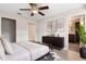 Spacious main bedroom with updated ceiling fan, ensuite bathroom, and ample closet space at 304 Hibiscus St, Chuluota, FL 32766