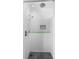Step-in shower with white and marble tile, mosaic accent, rainfall shower head, and handheld sprayer at 304 Hibiscus St, Chuluota, FL 32766