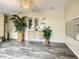 Contemporary lobby featuring decorative plants, mirrors, and stylish wood look floors at 6312 Buford St # 304, Orlando, FL 32835