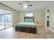 Bedroom with wood-look tile floors and sliding doors at 1501 Noble St, Longwood, FL 32750