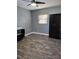 Spacious bedroom with wood-like tile floors and a double door wardrobe at 1501 Noble St, Longwood, FL 32750